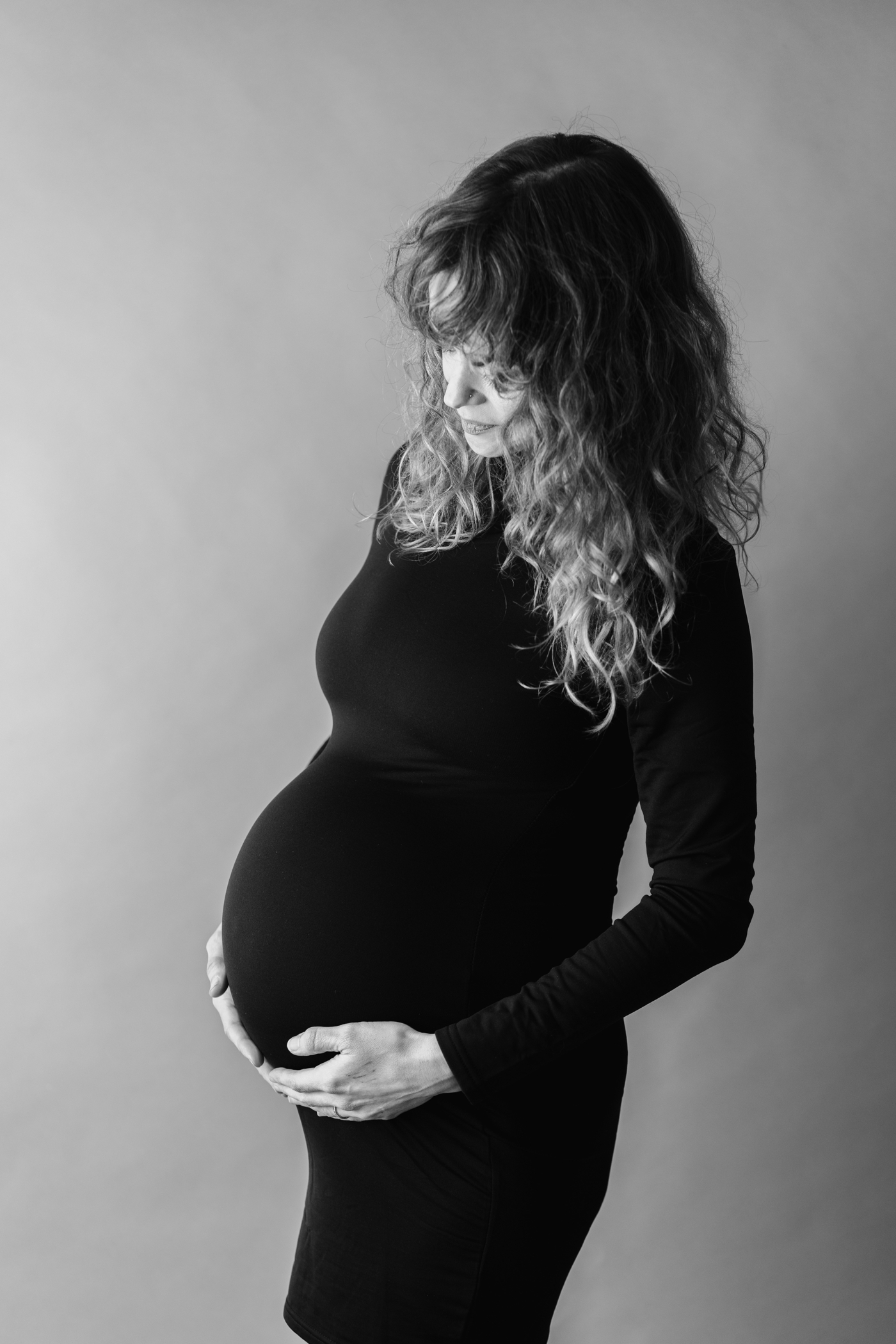 Black and white image of mom during Studio Maternity Session with Lauren Sosler Photography
