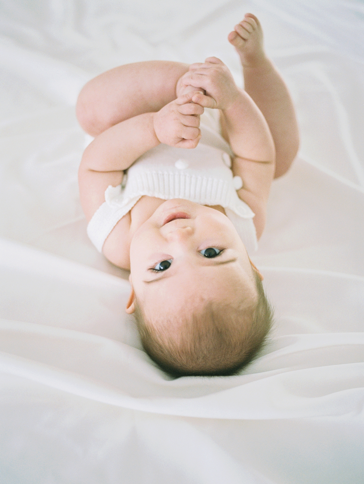 Film image of baby girl during milestone session in Asheville, NC. Photo by Lauren Sosler Photography.